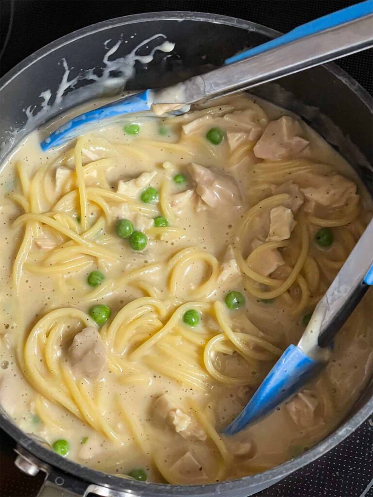 A chicken tetrazzini mixture in a pot.