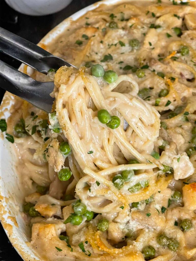 Chicken tetrazzini in a white baking dish.