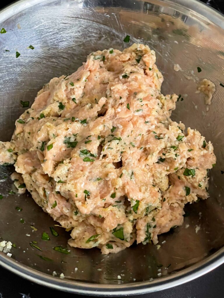 Chicken Piccata Meatballs mixture combined in a mixing bowl.