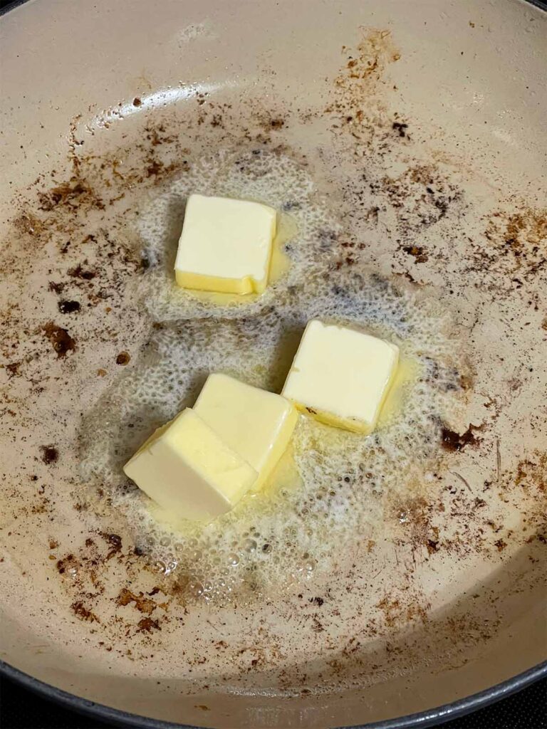 Butter melting in a skillet.