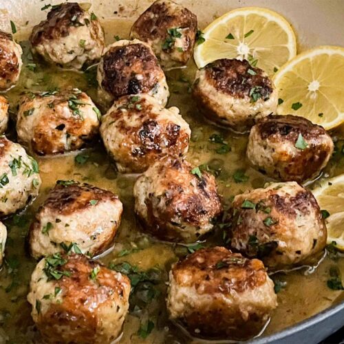 Chicken Piccata Meatballs in a skillet.