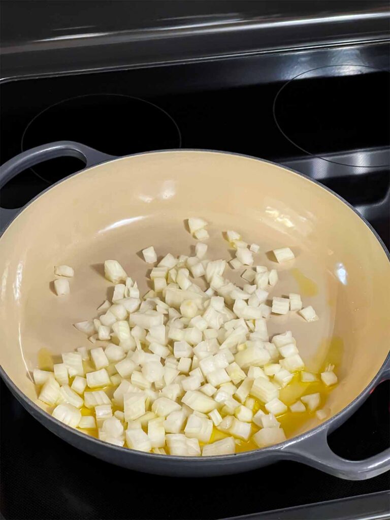 Onions cooking in a skillet.