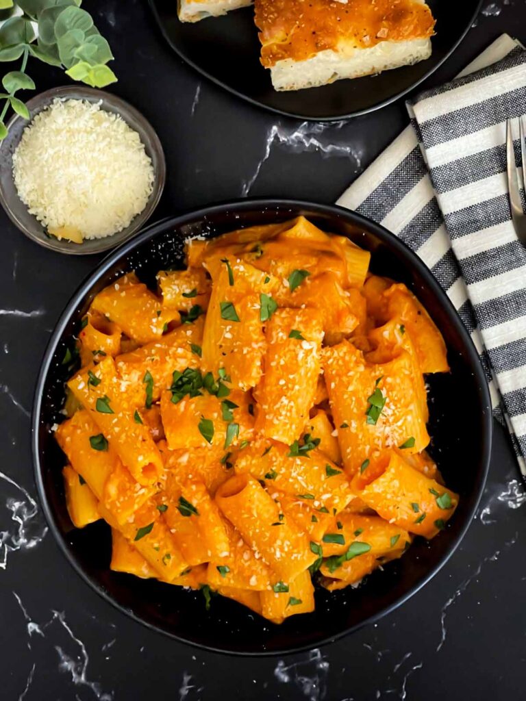 Pasta alla vodka in a dark bowl.