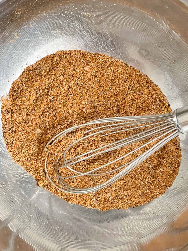 Spices blended together in a stainless steel bowl.