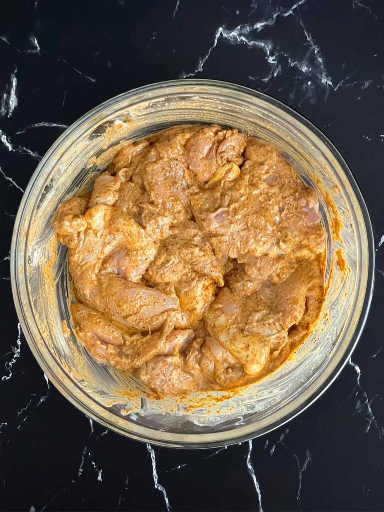 Chicken thighs in a shawarma marinade.