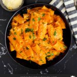 Pasta alla vodka in a dark bowl.