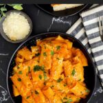 Pasta alla vodka in a dark bowl.