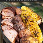 Smoked pork tenderloin with grilled corn and potatoes.