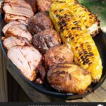 Smoked pork tenderloin with grilled corn and potatoes.