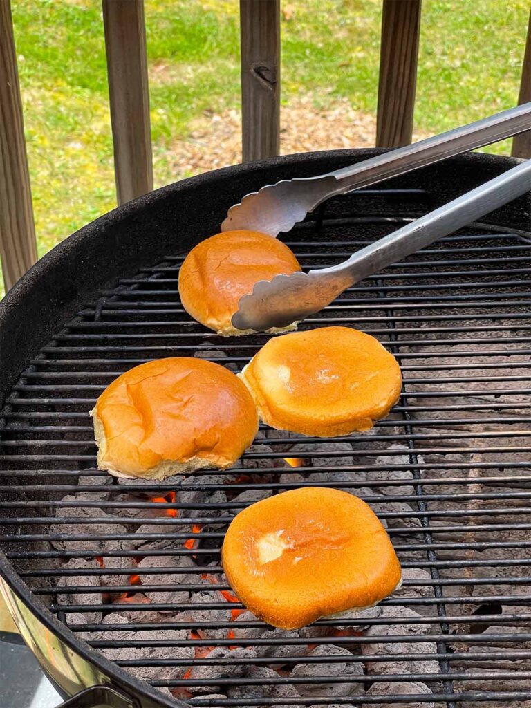 Buns being toasted on the grill.