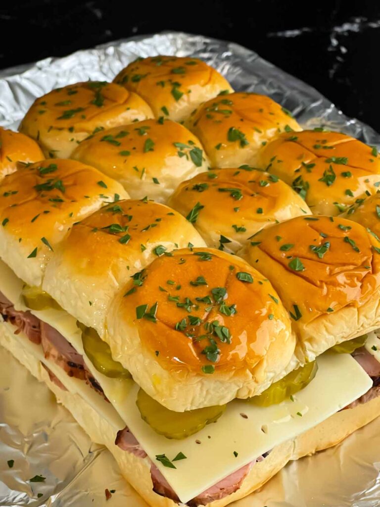 Cuban slider tops buttered with added chopped parsley.