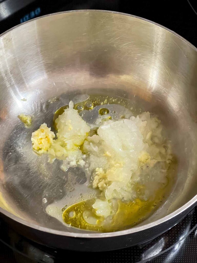 Grated onion cooking in olive oil.