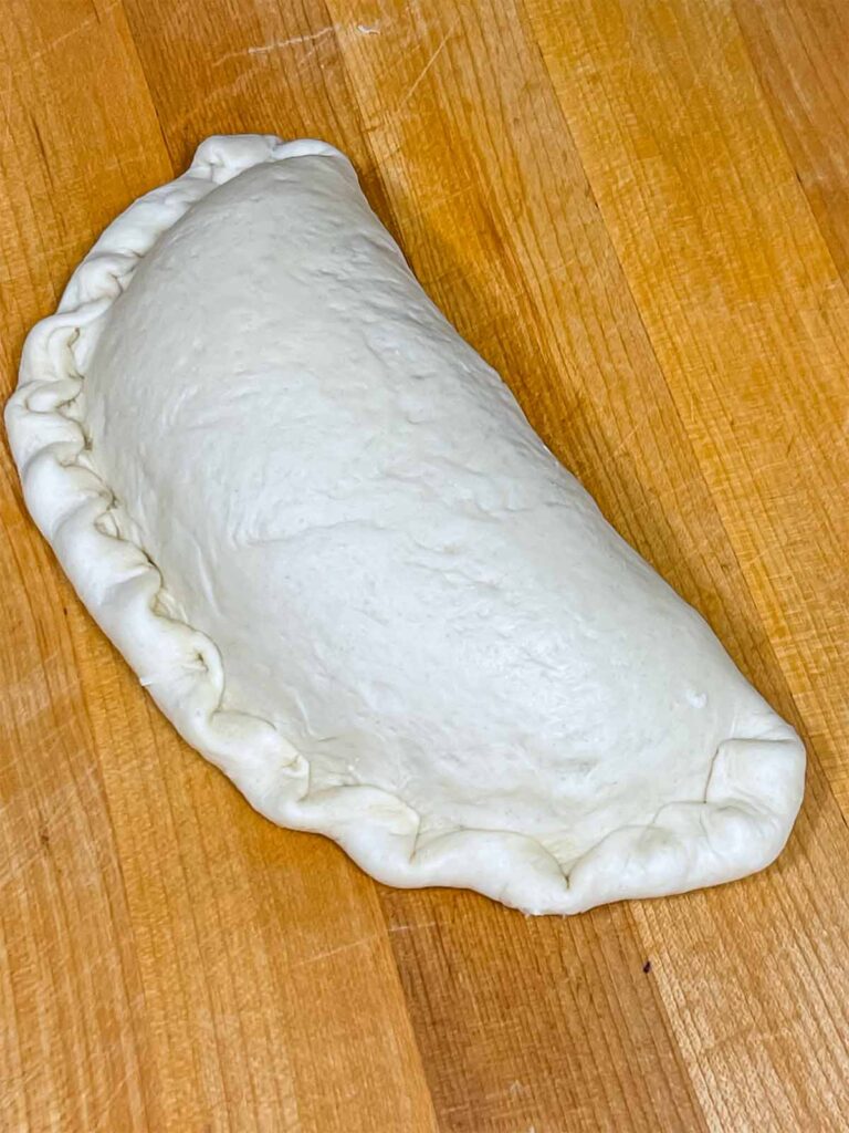 An Italian calzone ready to be baked.