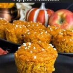 Pumpkin apple muffin on a dark plate.