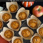 Pumpkin apple muffins on a wire rack.