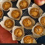 Pumpkin apple muffins on a wire rack.