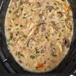 Slow cooker chicken and wild rice soup in the crock.