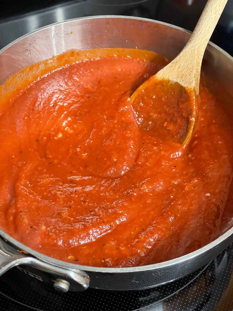 Homemade marinara sauce in a saucepan.