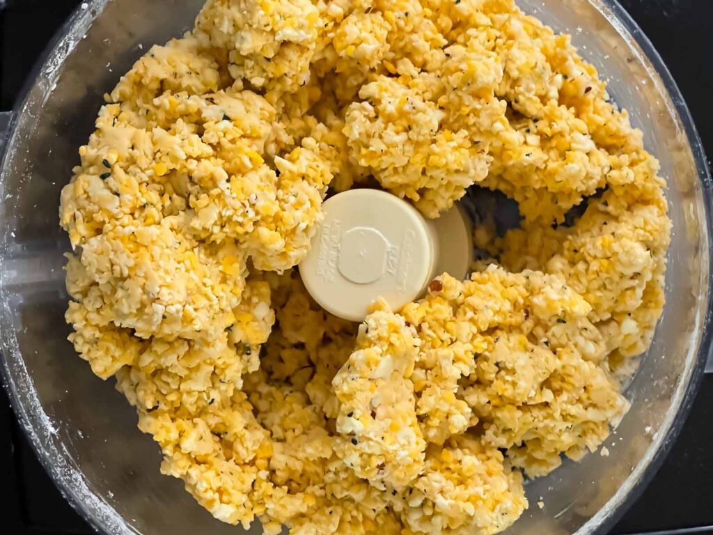 A cheese straw dough in a food processor.