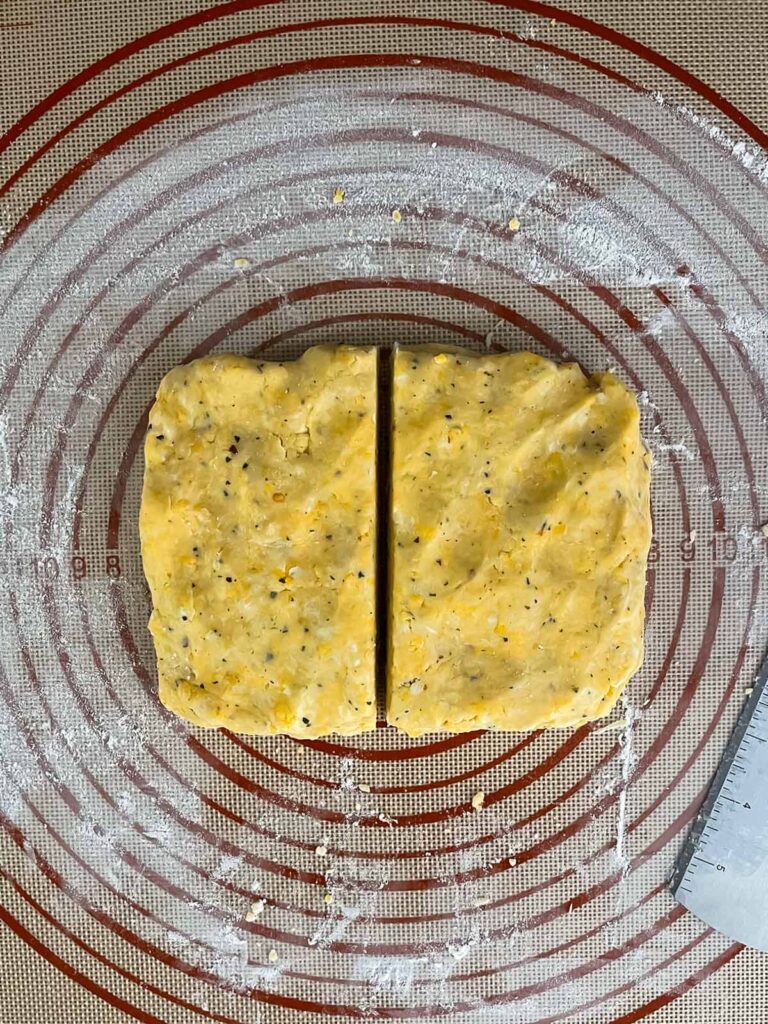 Cheese straw dough on a dough mat.