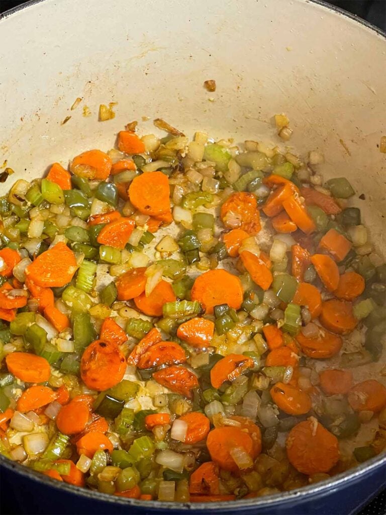 Cooked vegetables in a dutch oven.