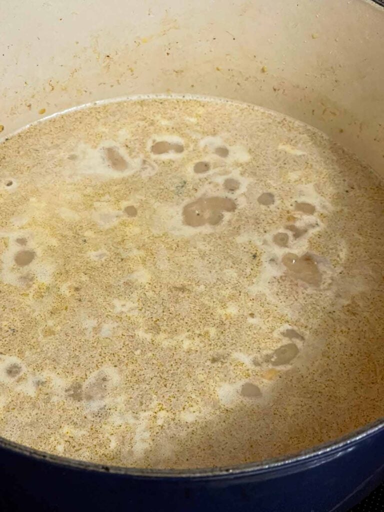 Bean soup cooking in a dutch oven.