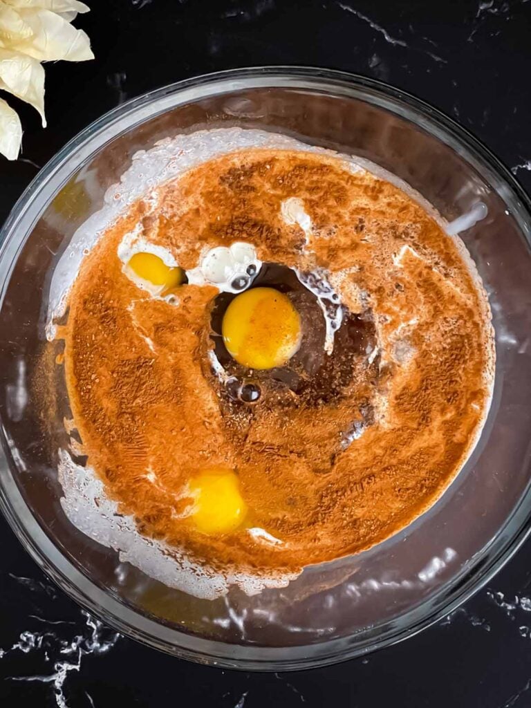 Apple butter pie mixture in a glass bowl.