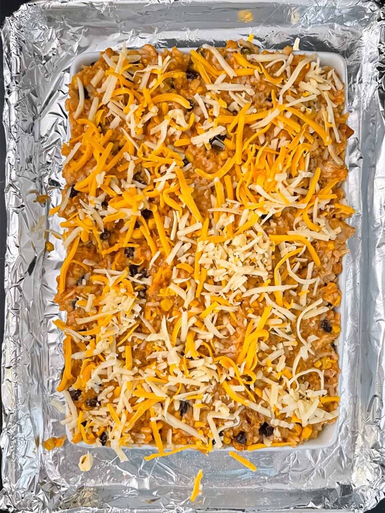 Unbaked chicken enchilada rice casserole.